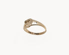 Vintage signet ring reworked with etched face, side view. 