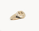 Vintage signet ring reworked with etched face, front view.