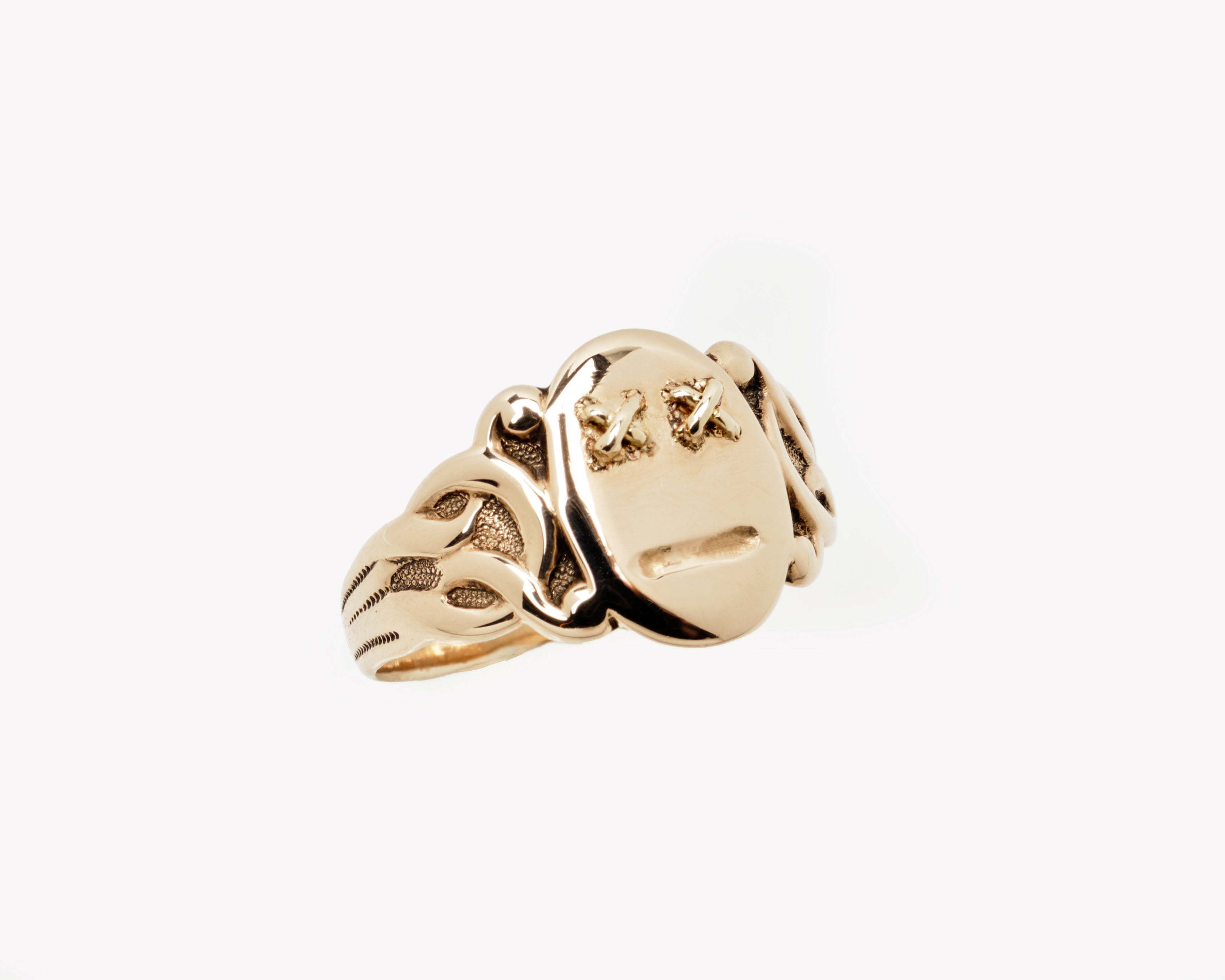 Vintage signet ring reworked with etched face, side view. 