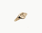 Vintage signet ring reworked with etched face, front view. 