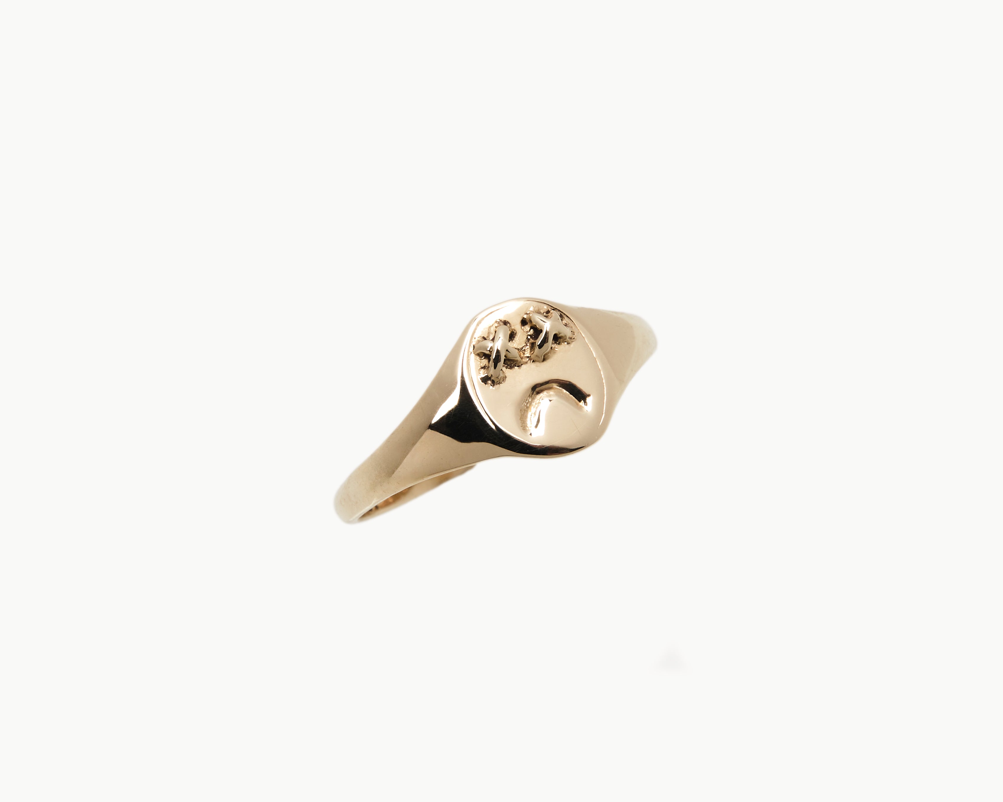 Vintage signet ring reworked with etched face, front view. 