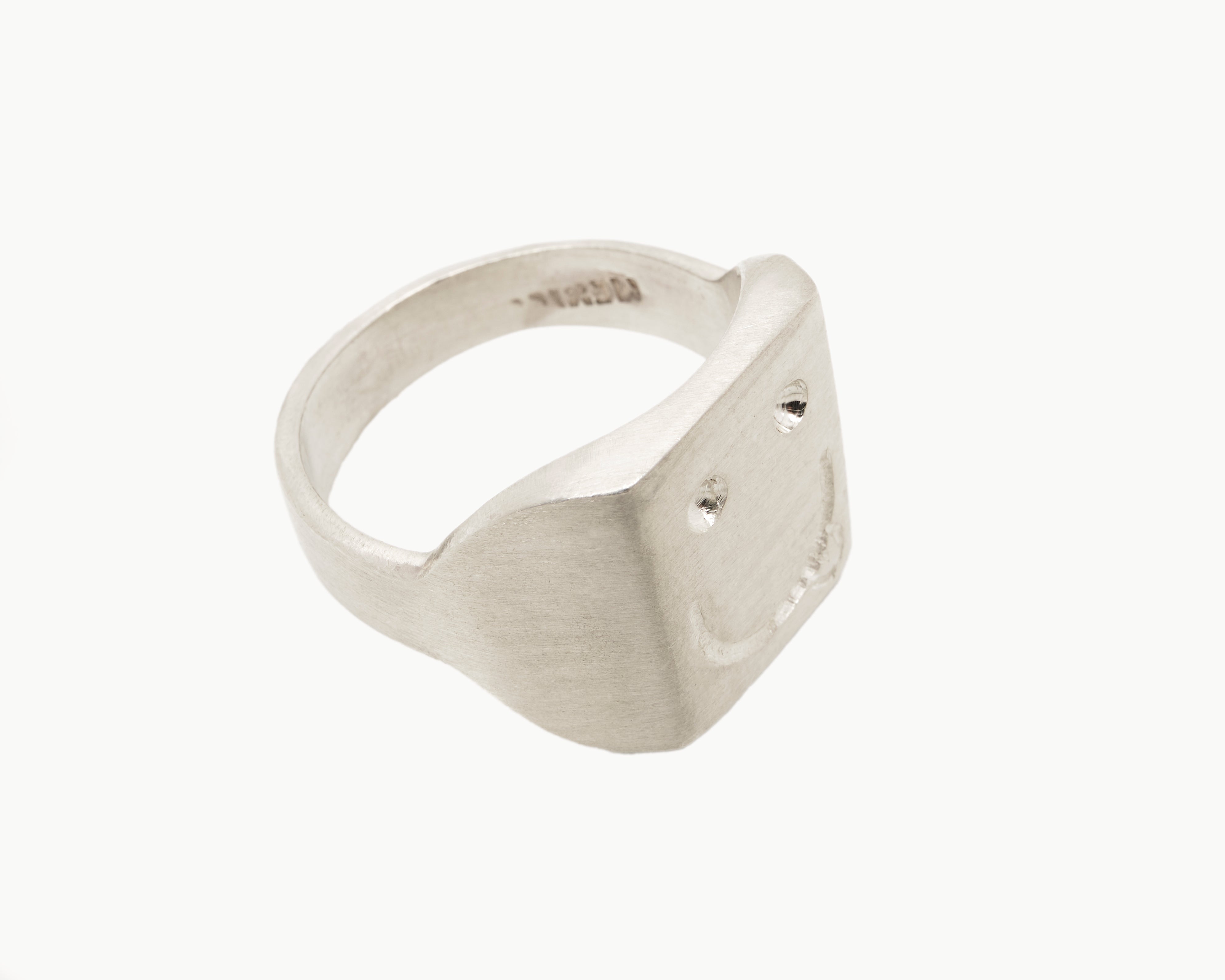 Vintage signet ring reworked with etched face, top view. 