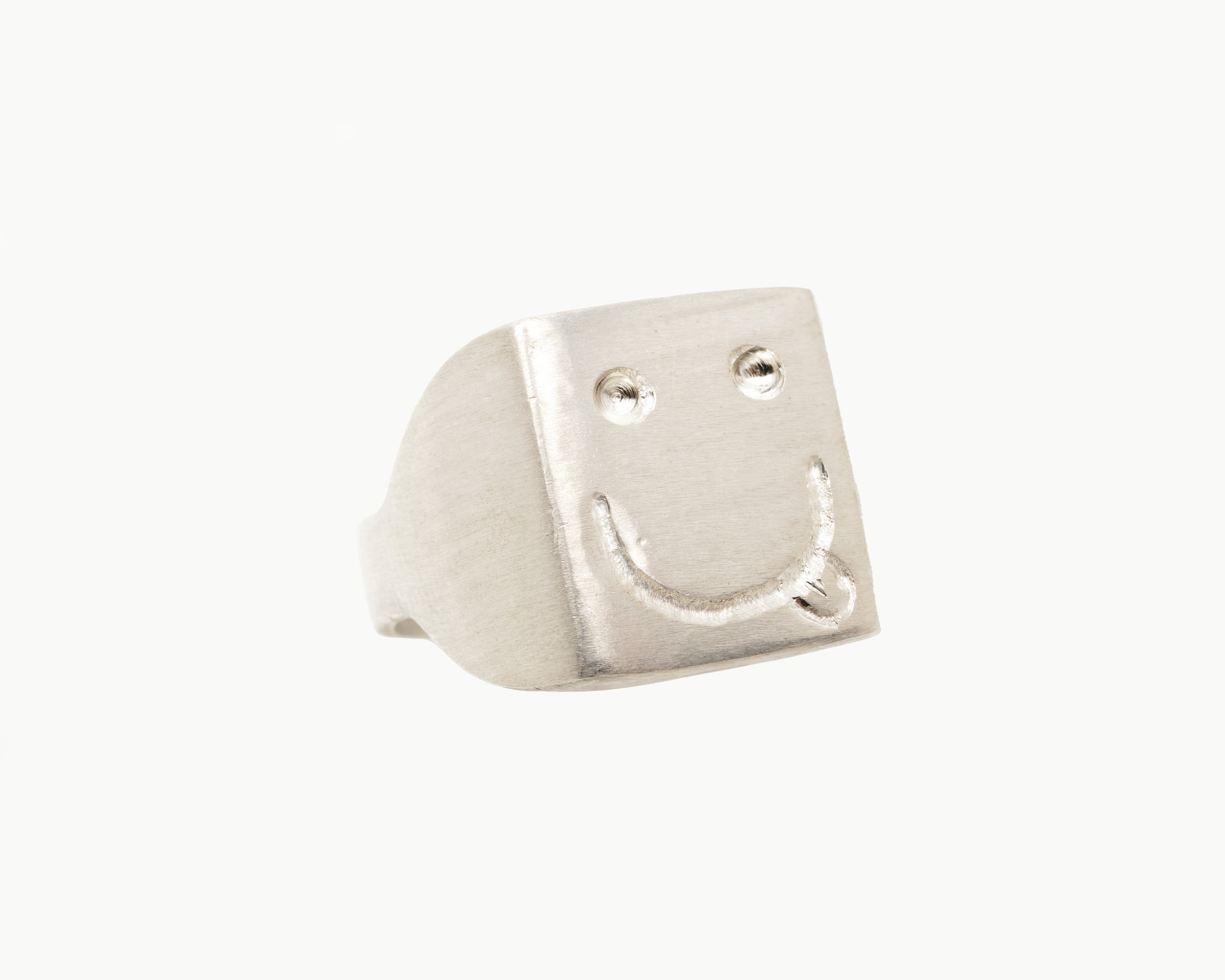 Vintage signet ring reworked with etched face, front view. 
