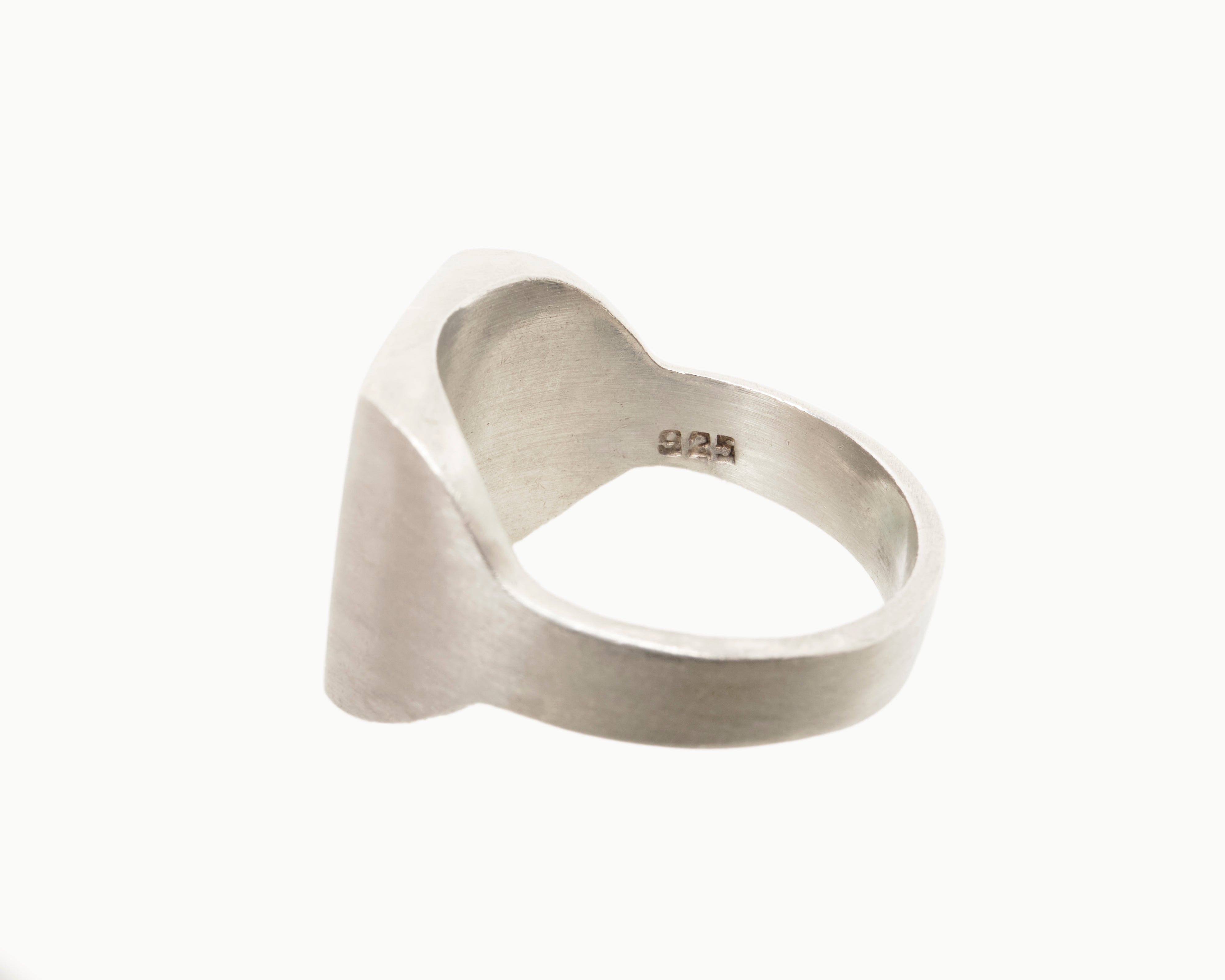Vintage signet ring reworked with etched face, back view. 
