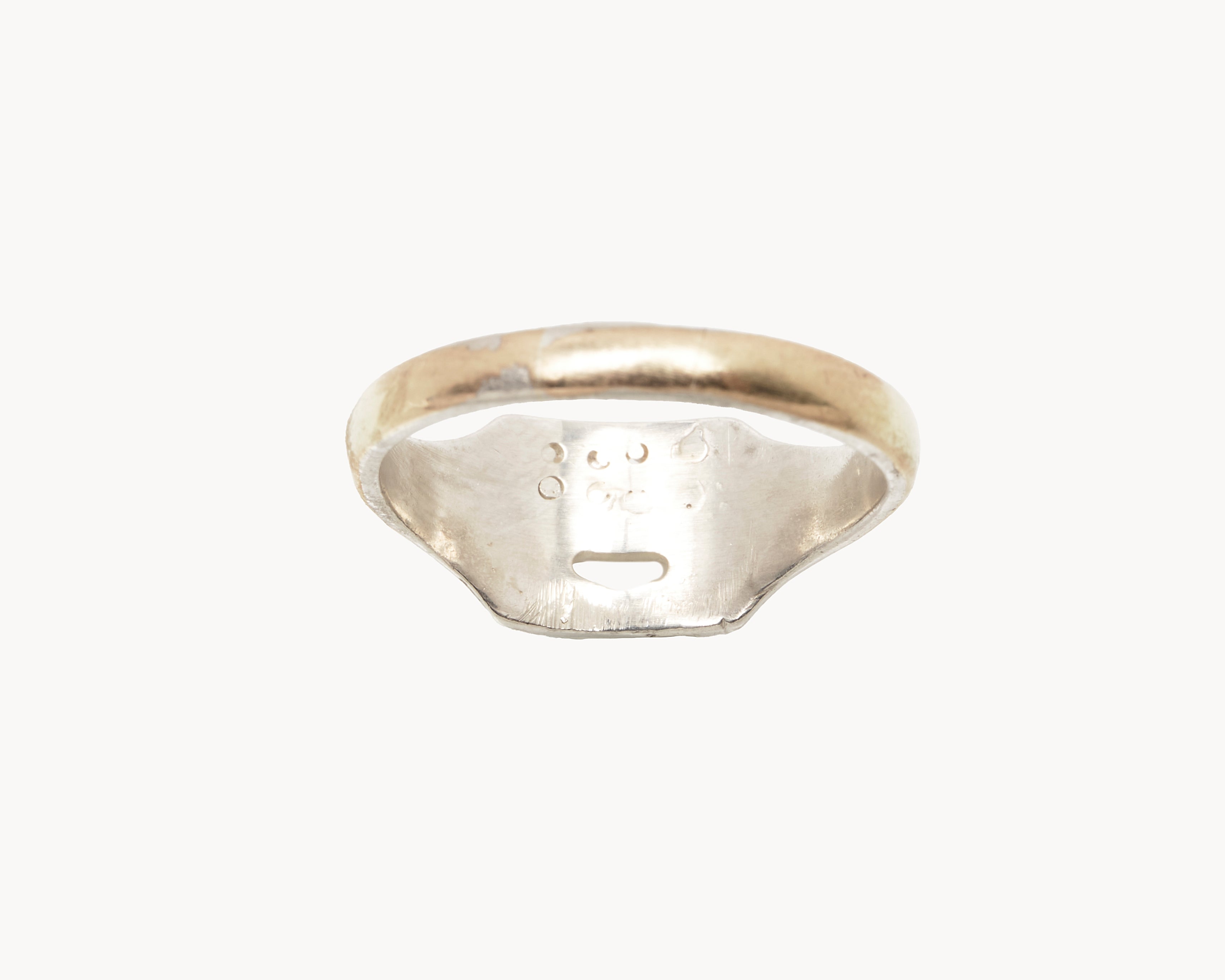 Vintage signet ring reworked with etched face, back view. 