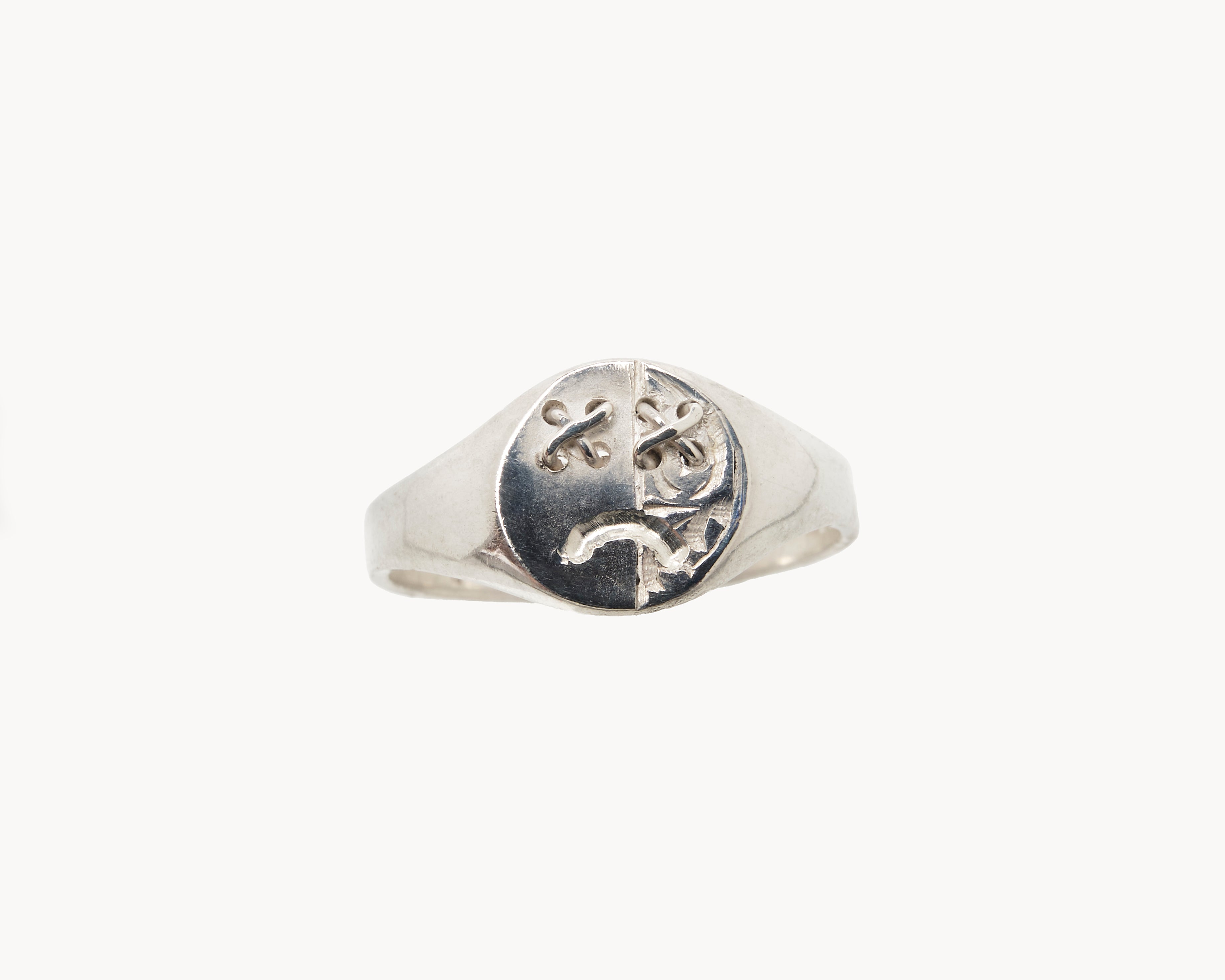 Vintage signet ring reworked with etched face, front view. 
