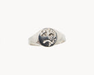 Vintage signet ring reworked with etched face, front view. 