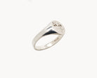 Vintage signet ring reworked with etched face, side view. 