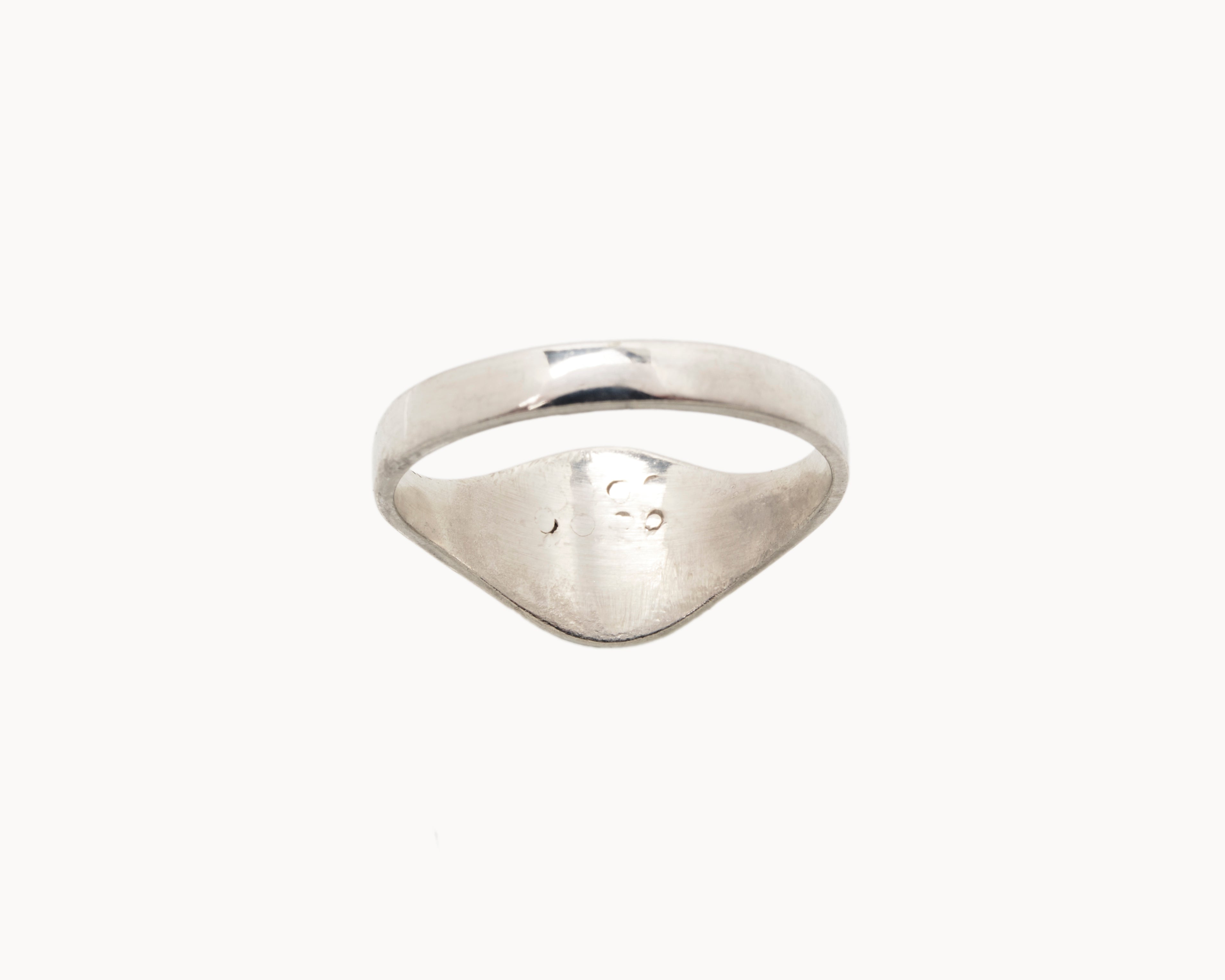 Vintage signet ring reworked with etched face, back view. 
