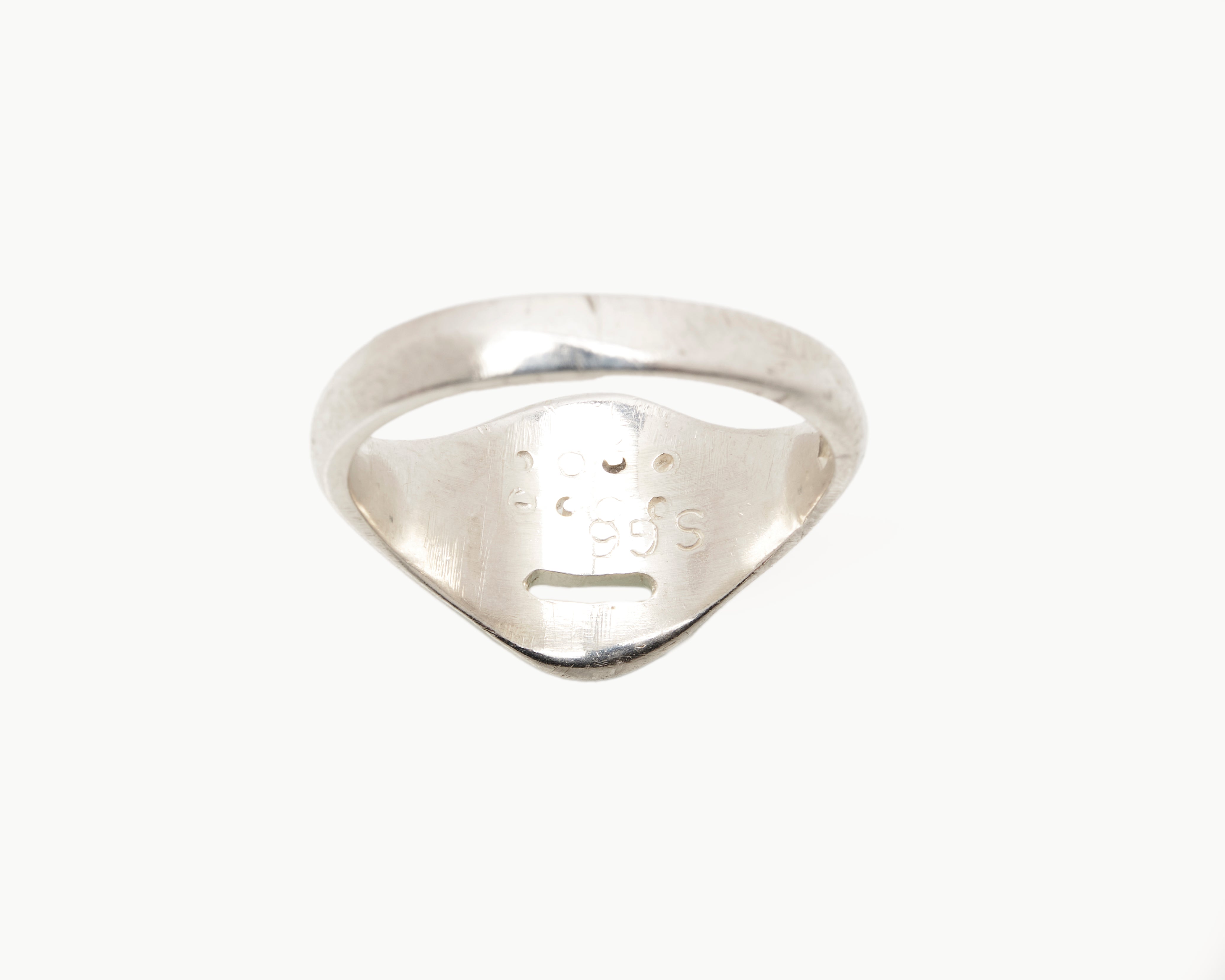 Vintage signet ring reworked with etched face, back view. 