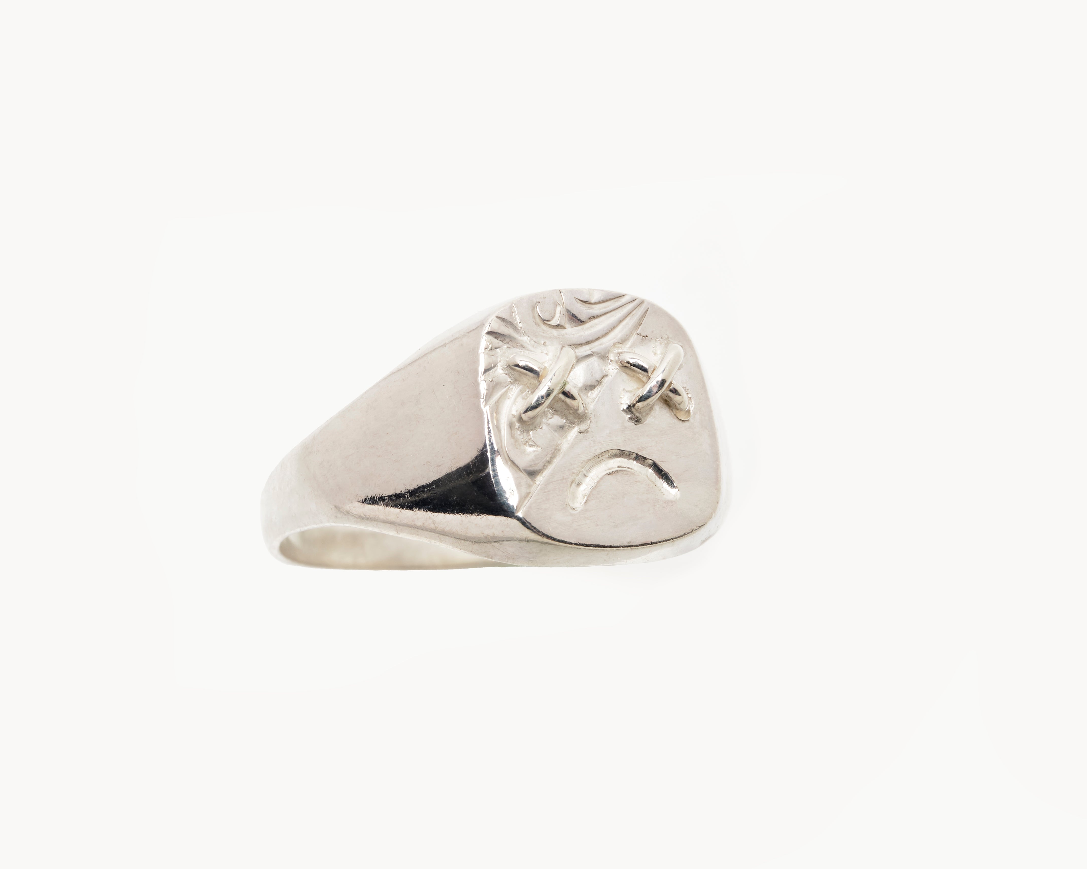 Vintage signet ring reworked with etched face, front view. 