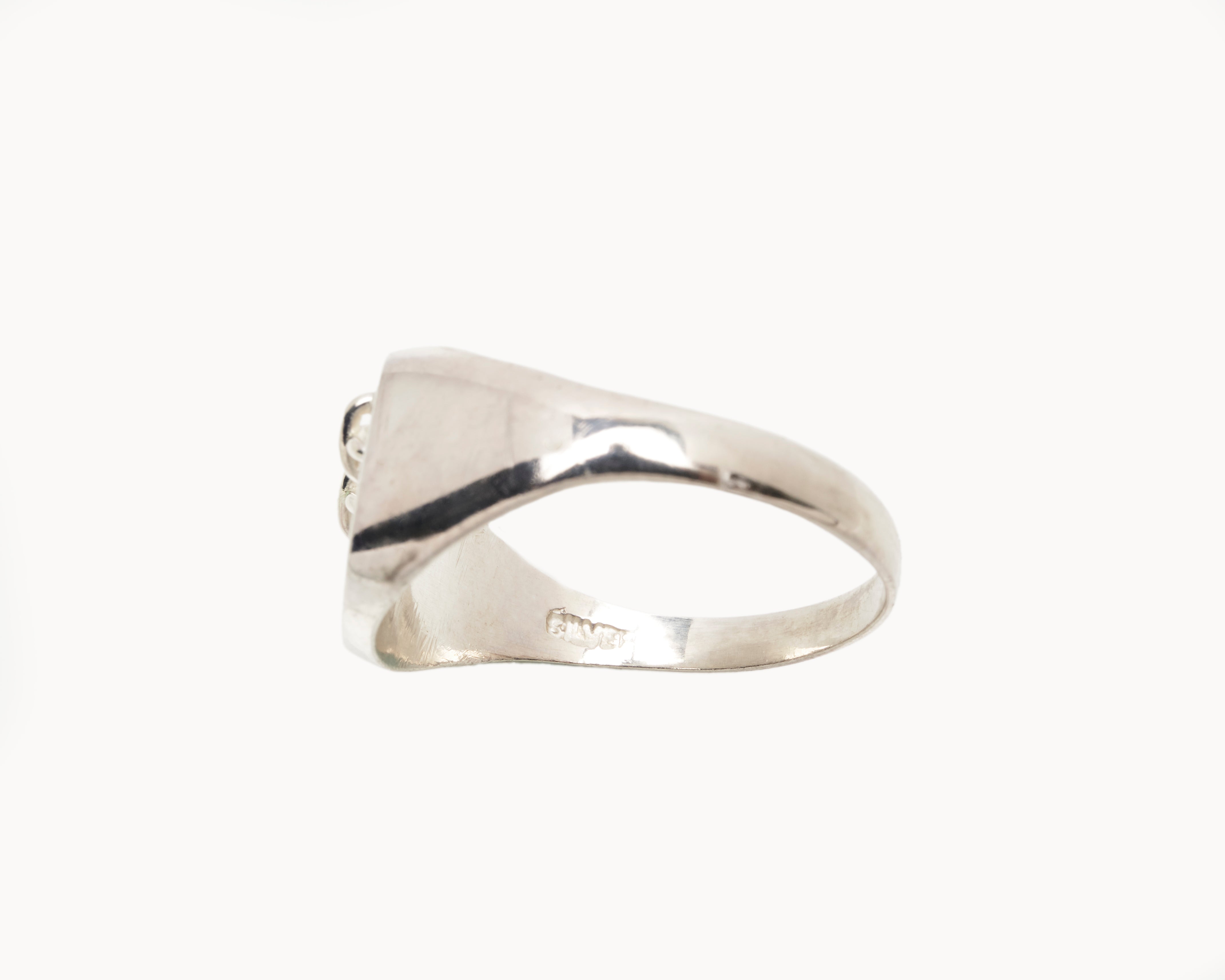 Vintage signet ring reworked with etched face, side view. 