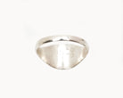 Vintage signet ring reworked with etched face, back view. 