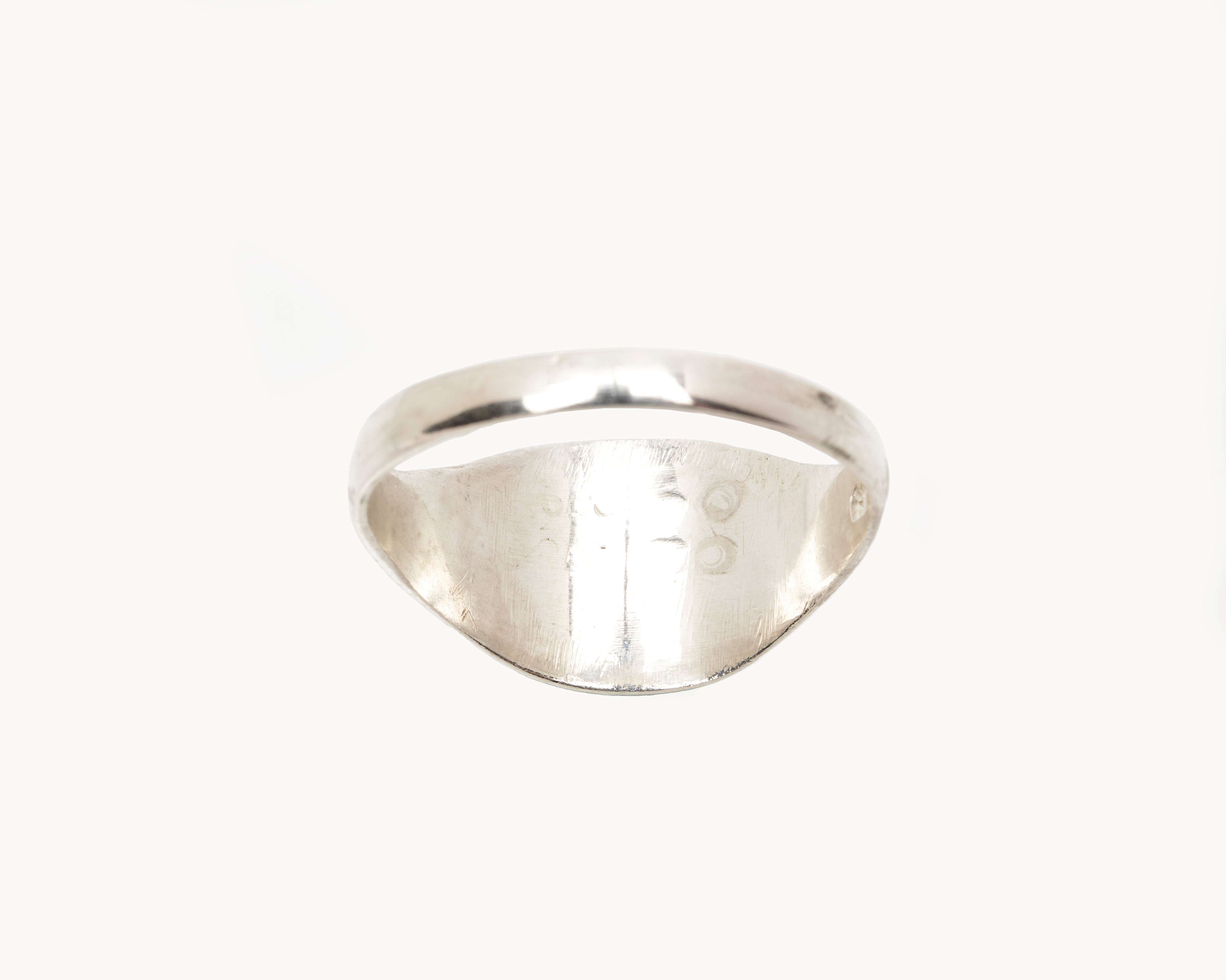 Vintage signet ring reworked with etched face, back view. 