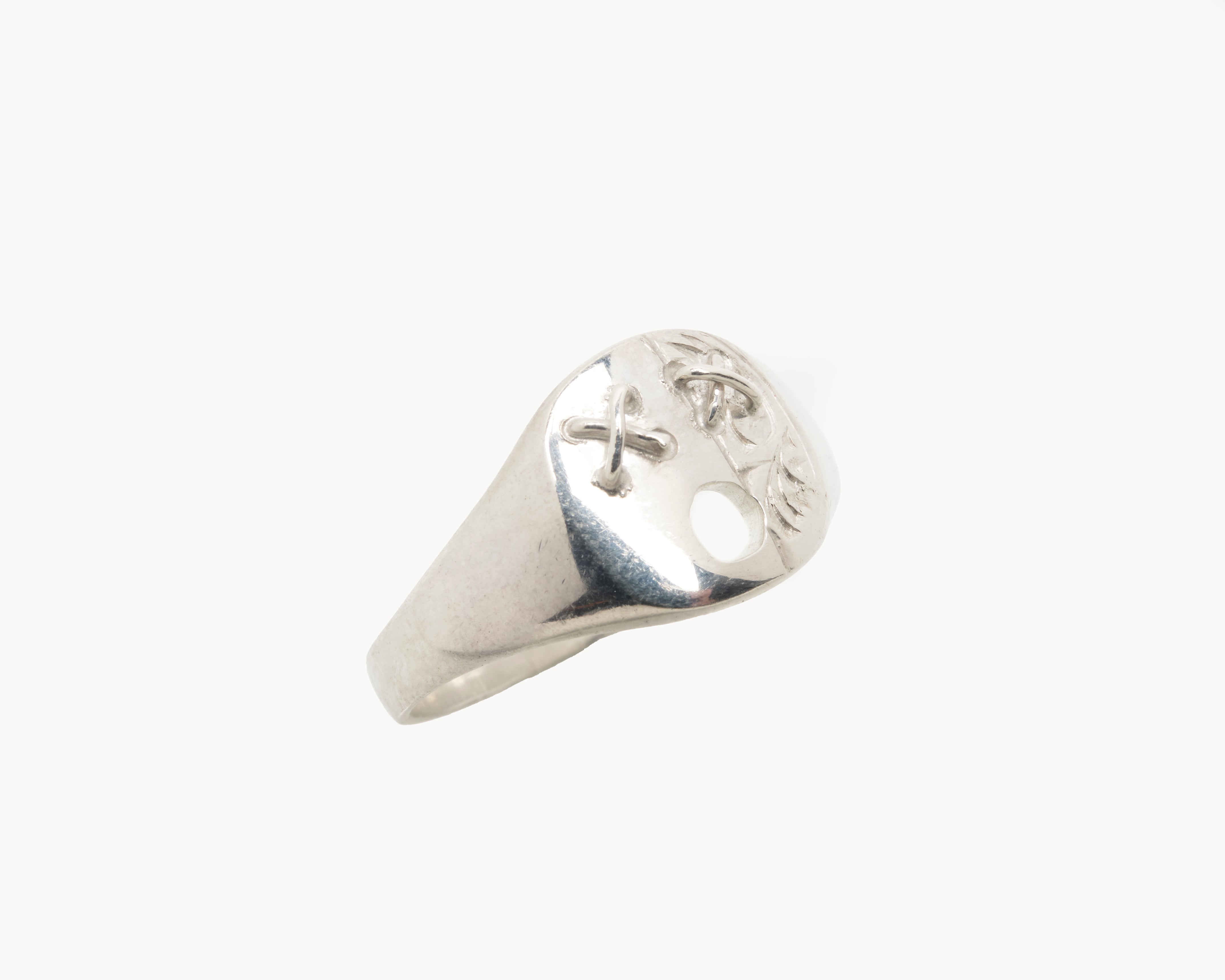 Vintage signet ring reworked with etched face, front view. 