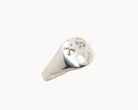 Vintage signet ring reworked with etched face, front view. 