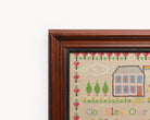 Upcycled framed sampler, close up view 