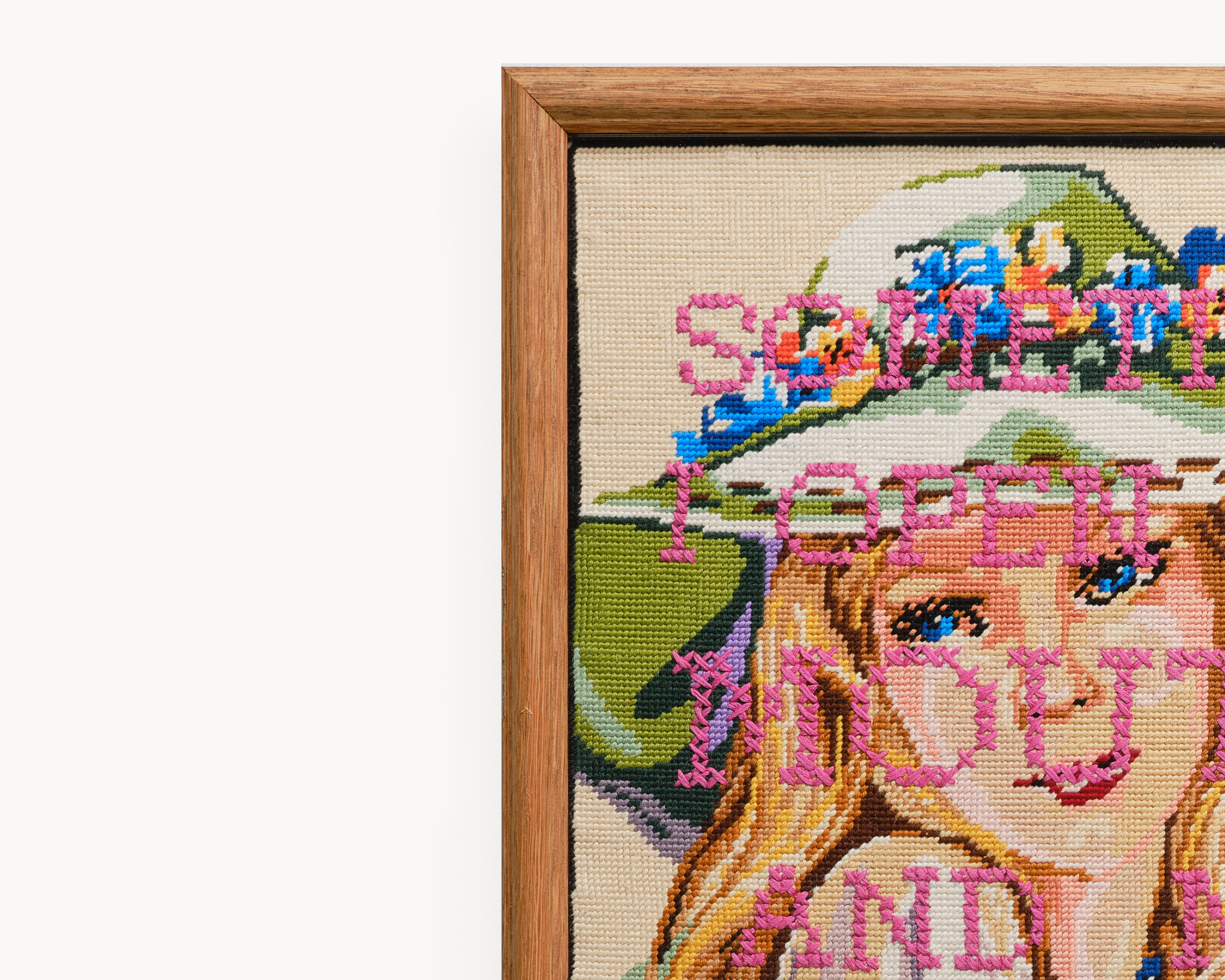 Upcycled framed sampler, close up view 