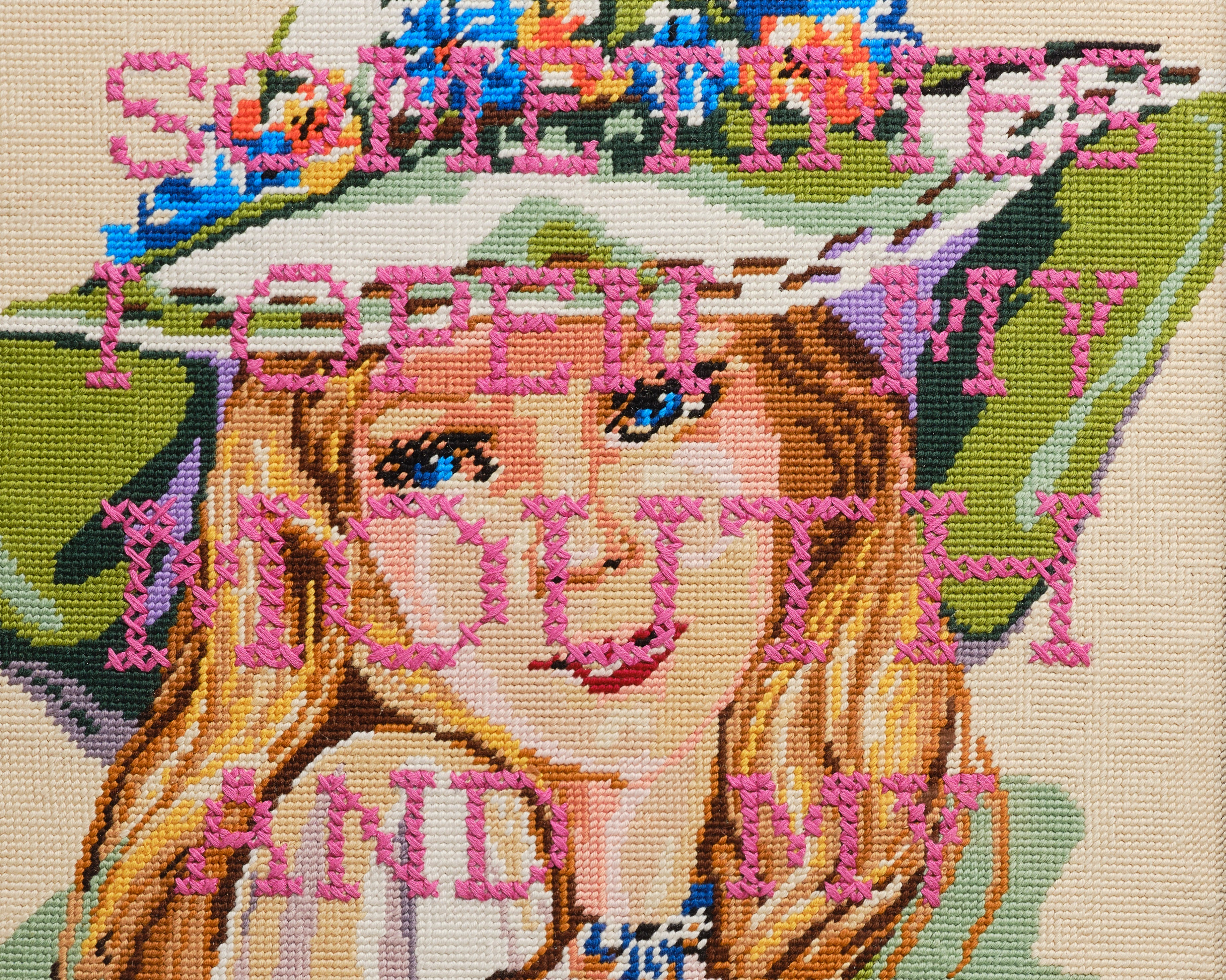 Upcycled framed sampler, close up view 