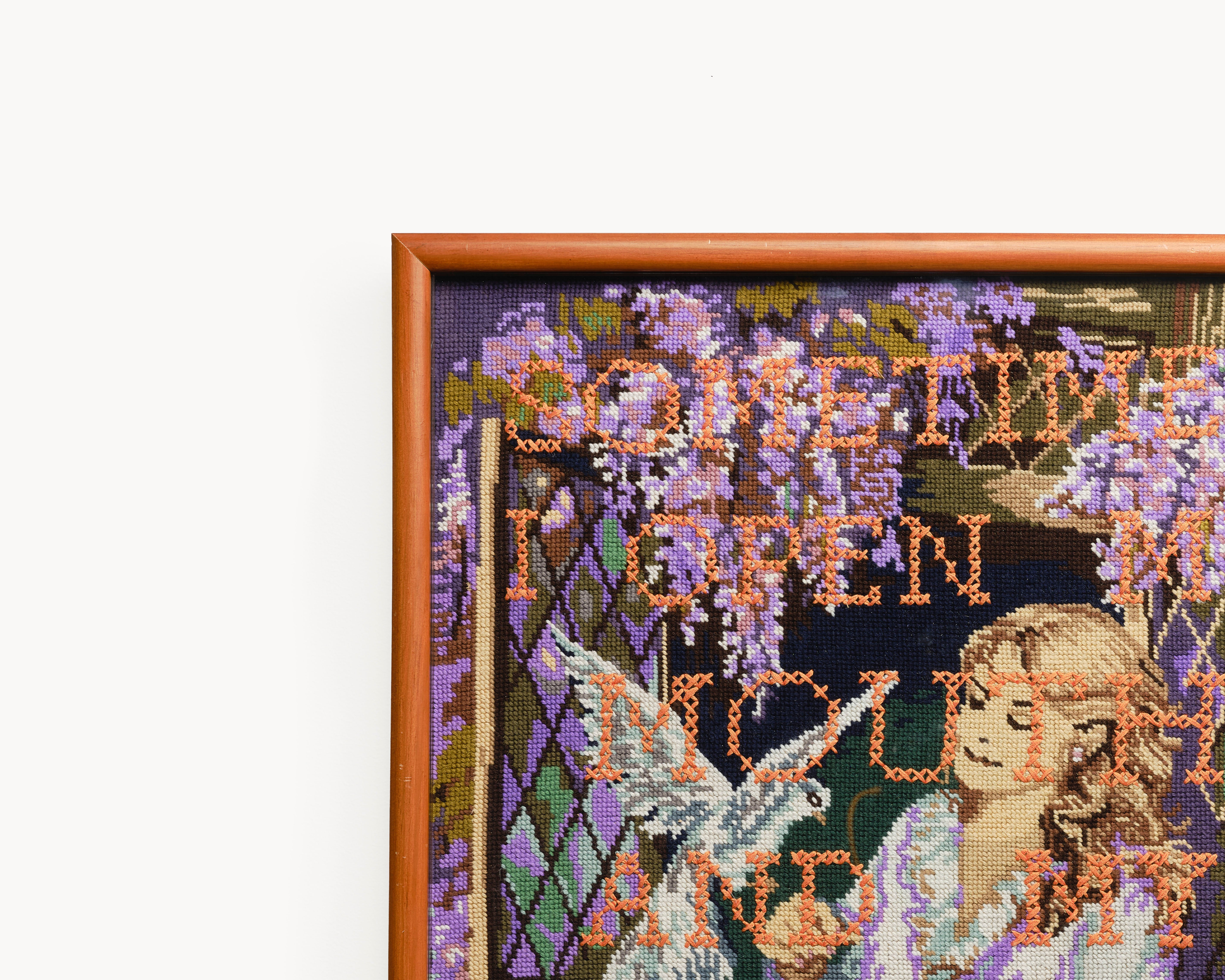 Upcycled framed sampler, close up view 