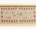 Upcycled framed sampler, close up view 