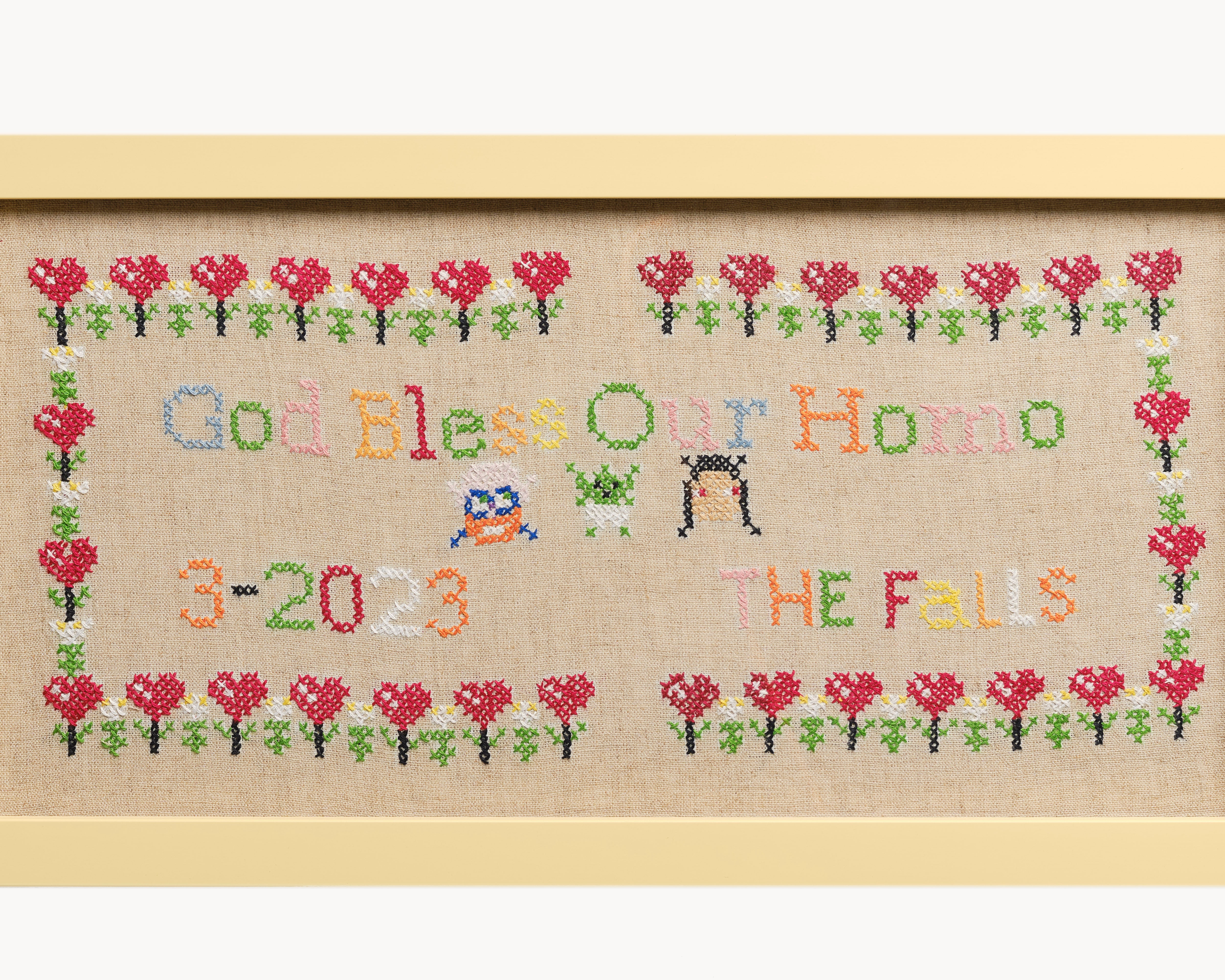 Upcycled framed sampler, close up view 