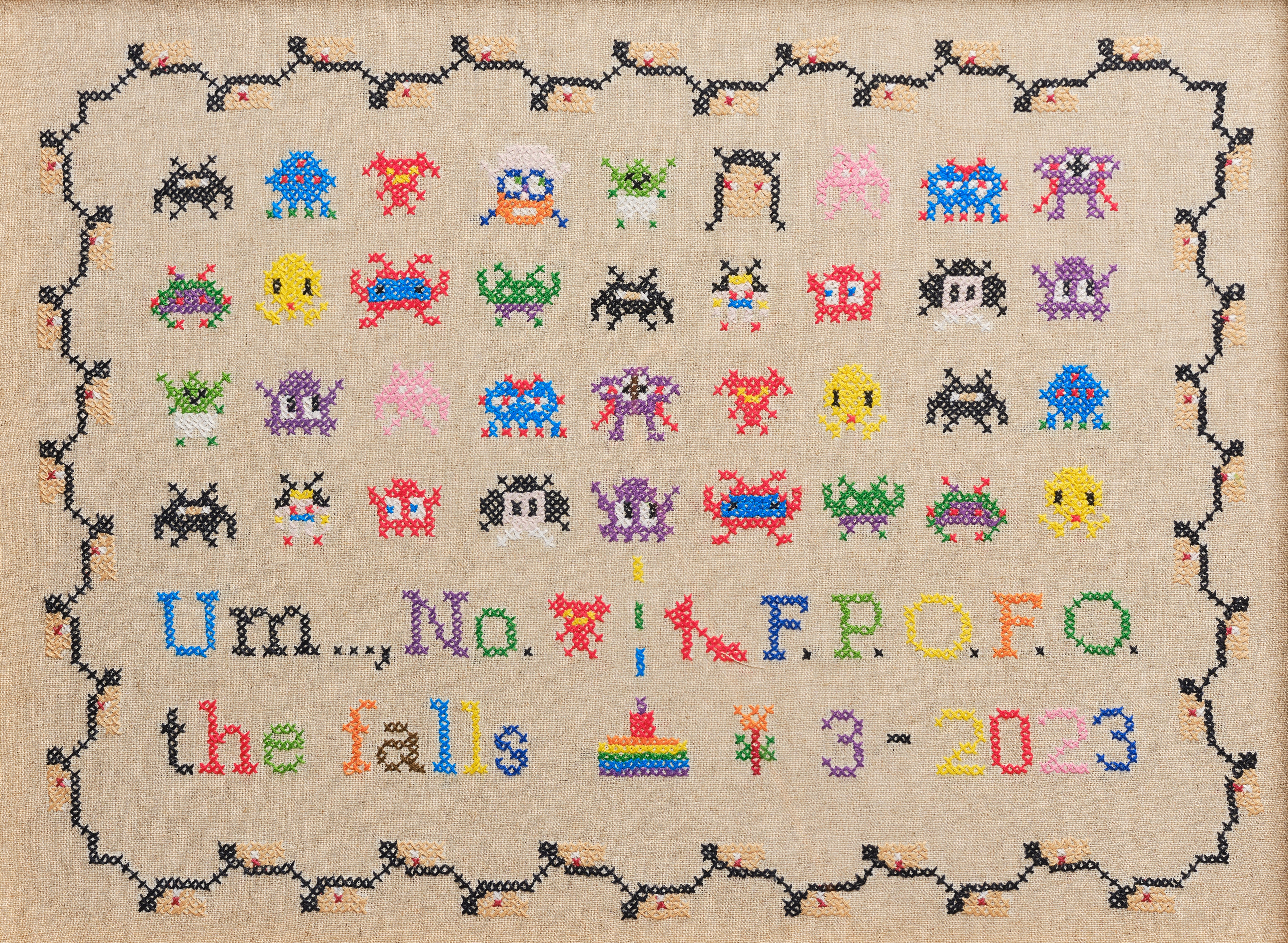 Upcycled framed sampler, close up view 