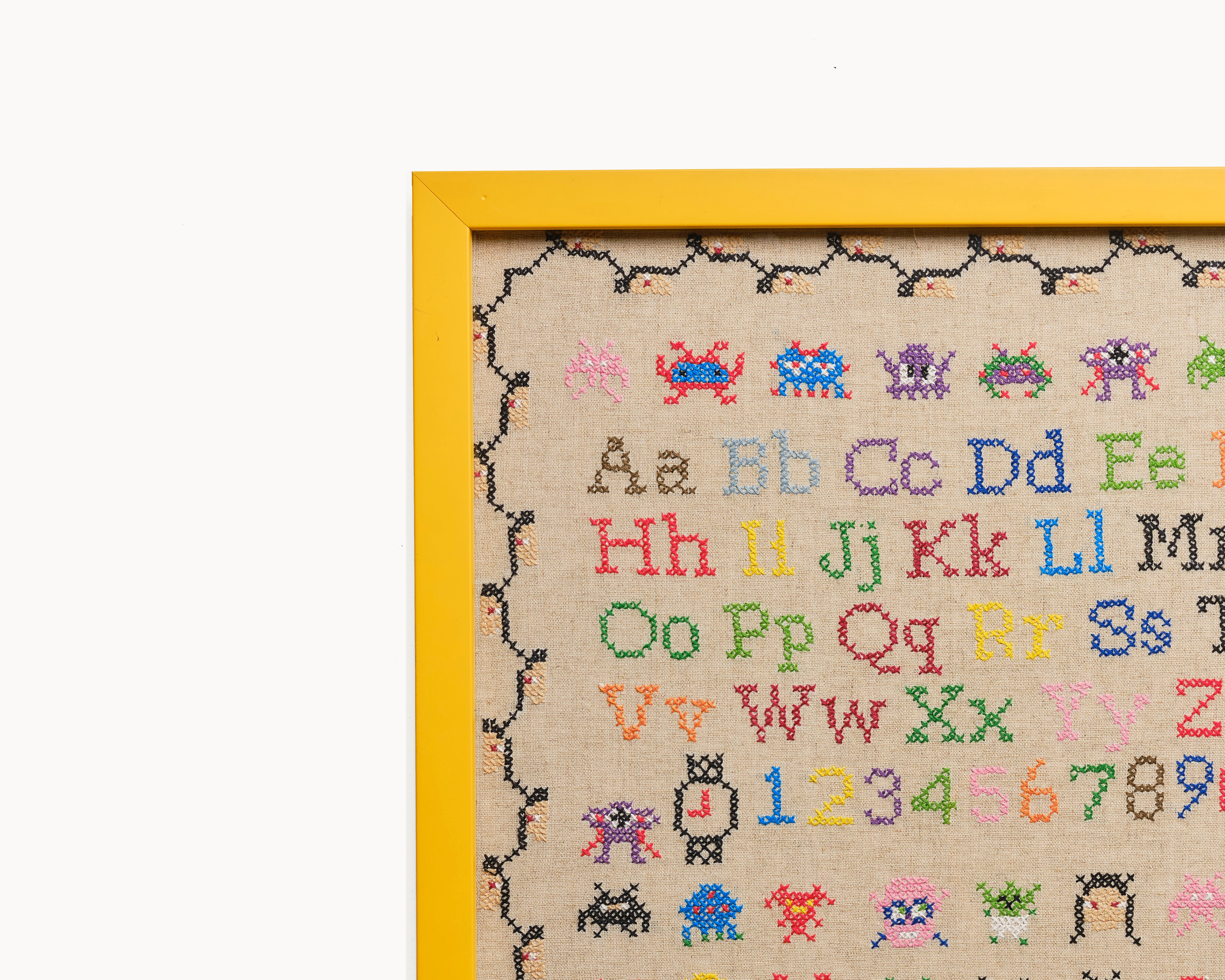 Upcycled framed sampler, close up view 