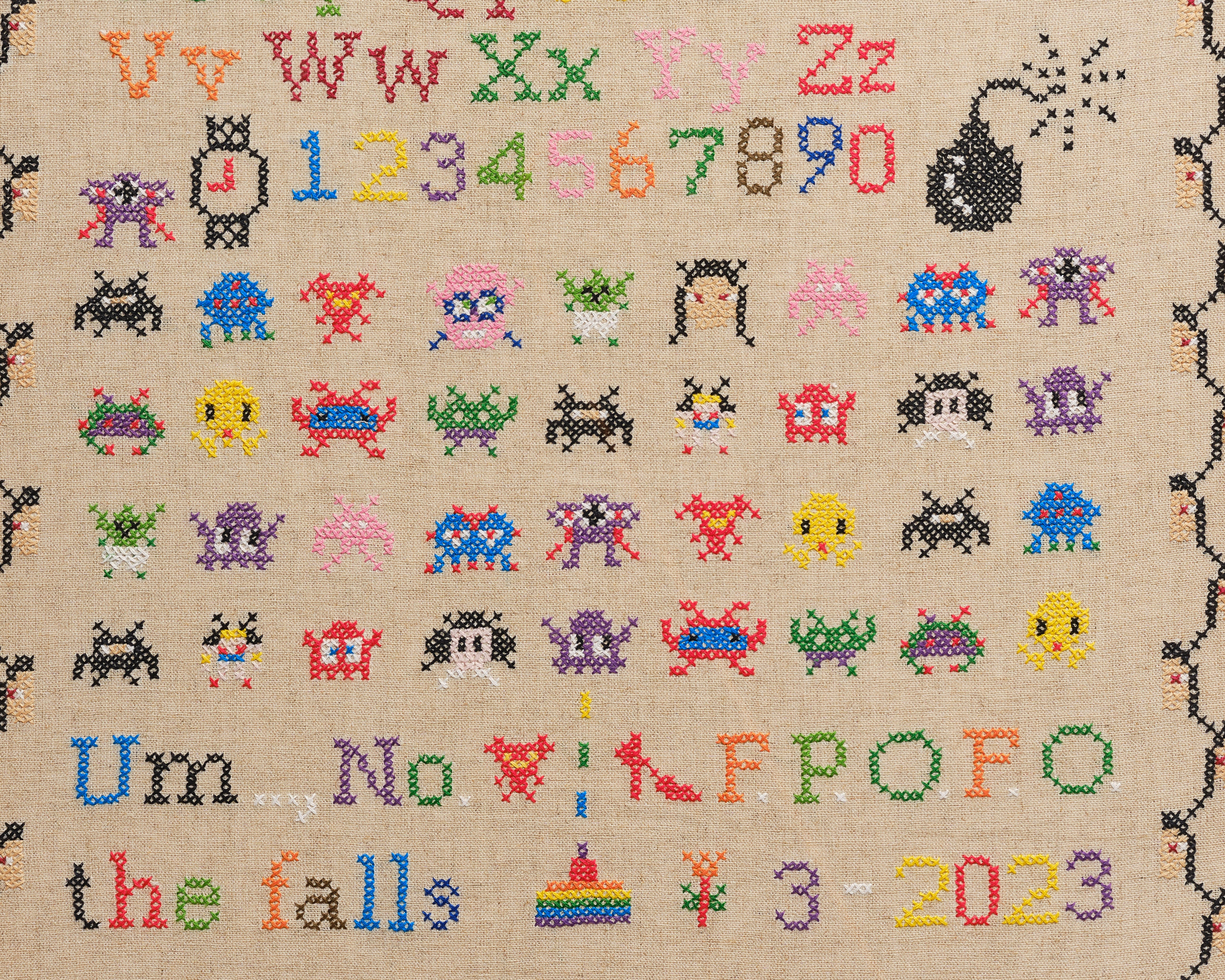 Upcycled framed sampler, close up view 