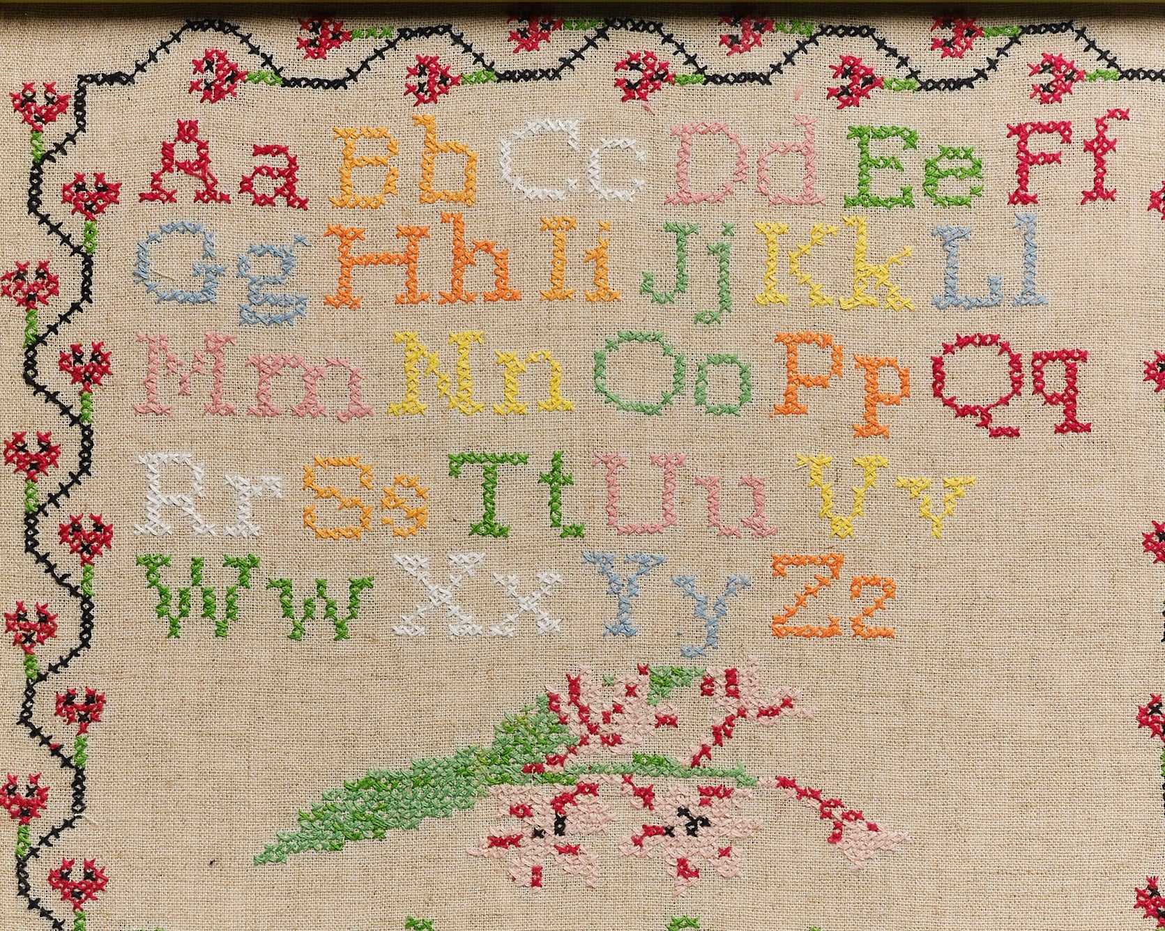 Upcycled framed sampler, close up view 