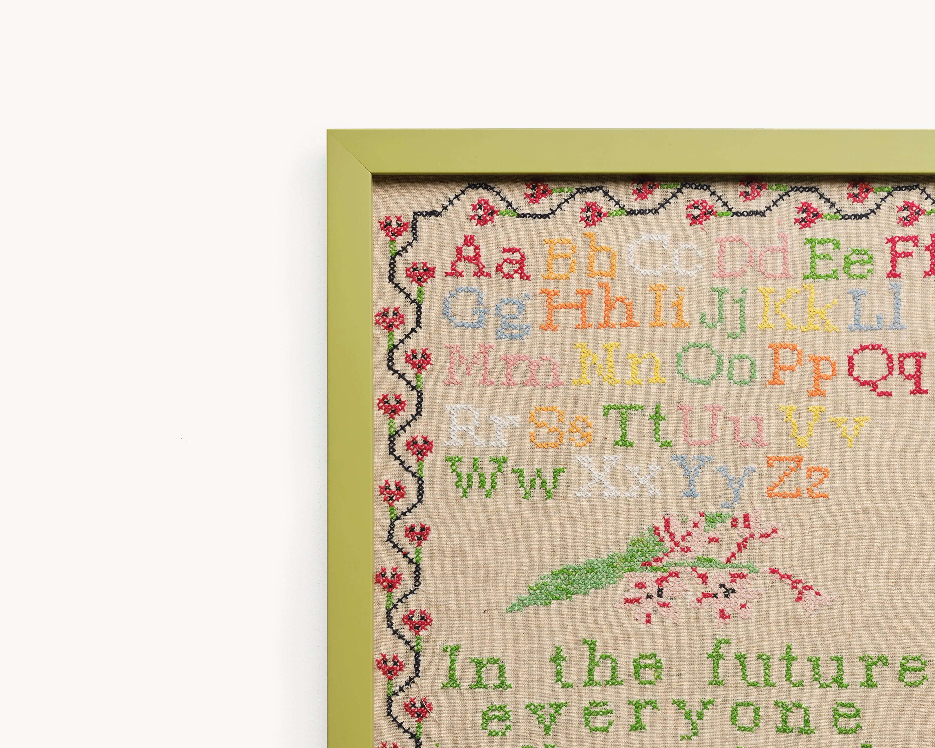 Upcycled framed sampler, close up view 