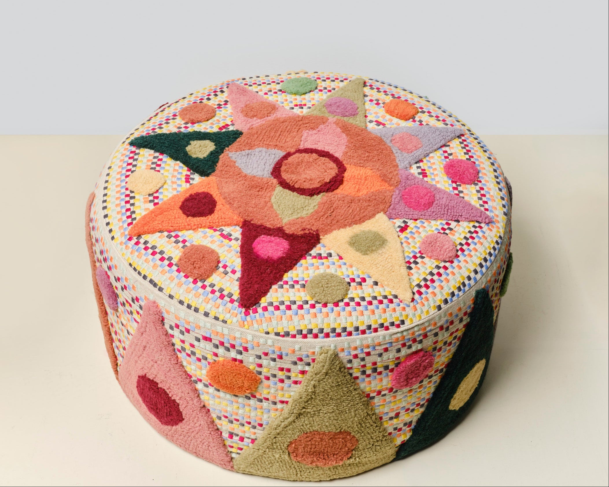 Pouff with tufted embellishment, top view