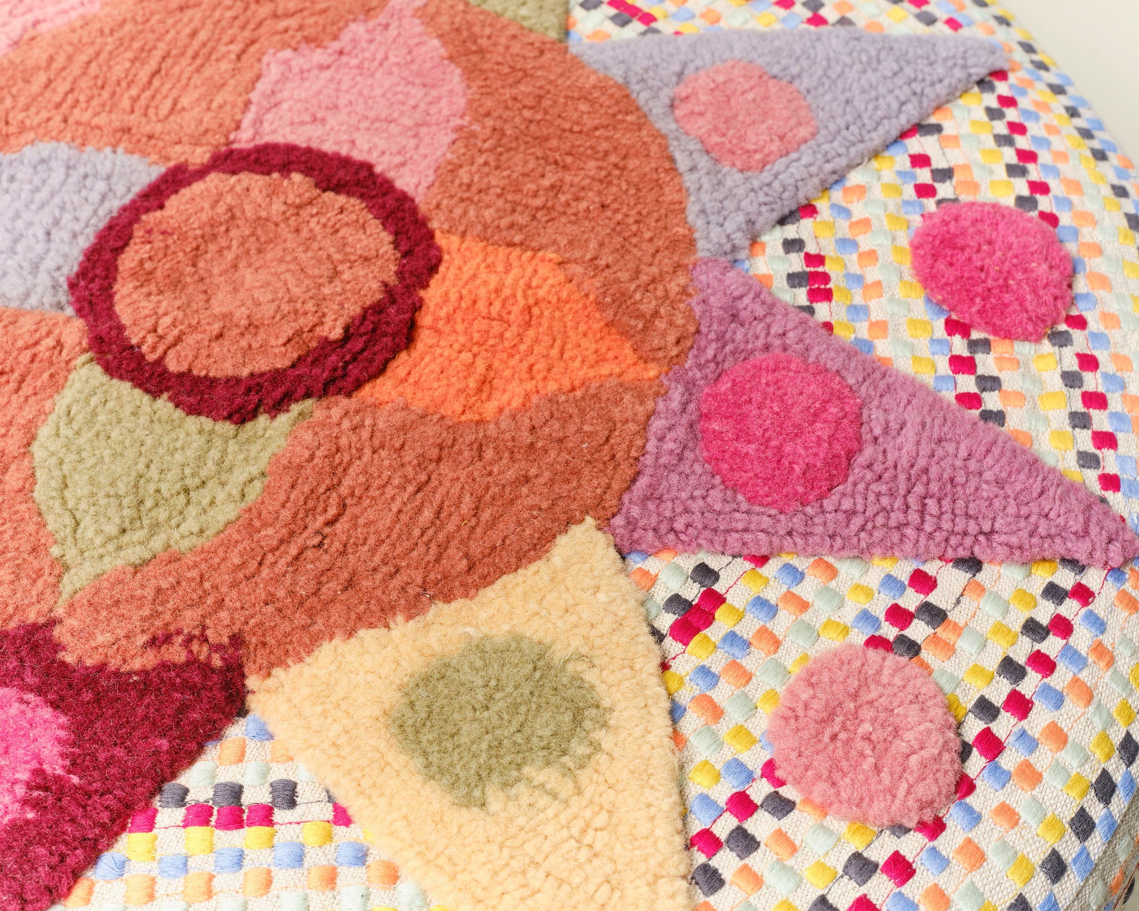 Pouff with tufted embellishment, close up view