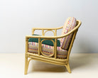 Upcycled chair with tufted and embroidered embellishments, side view 