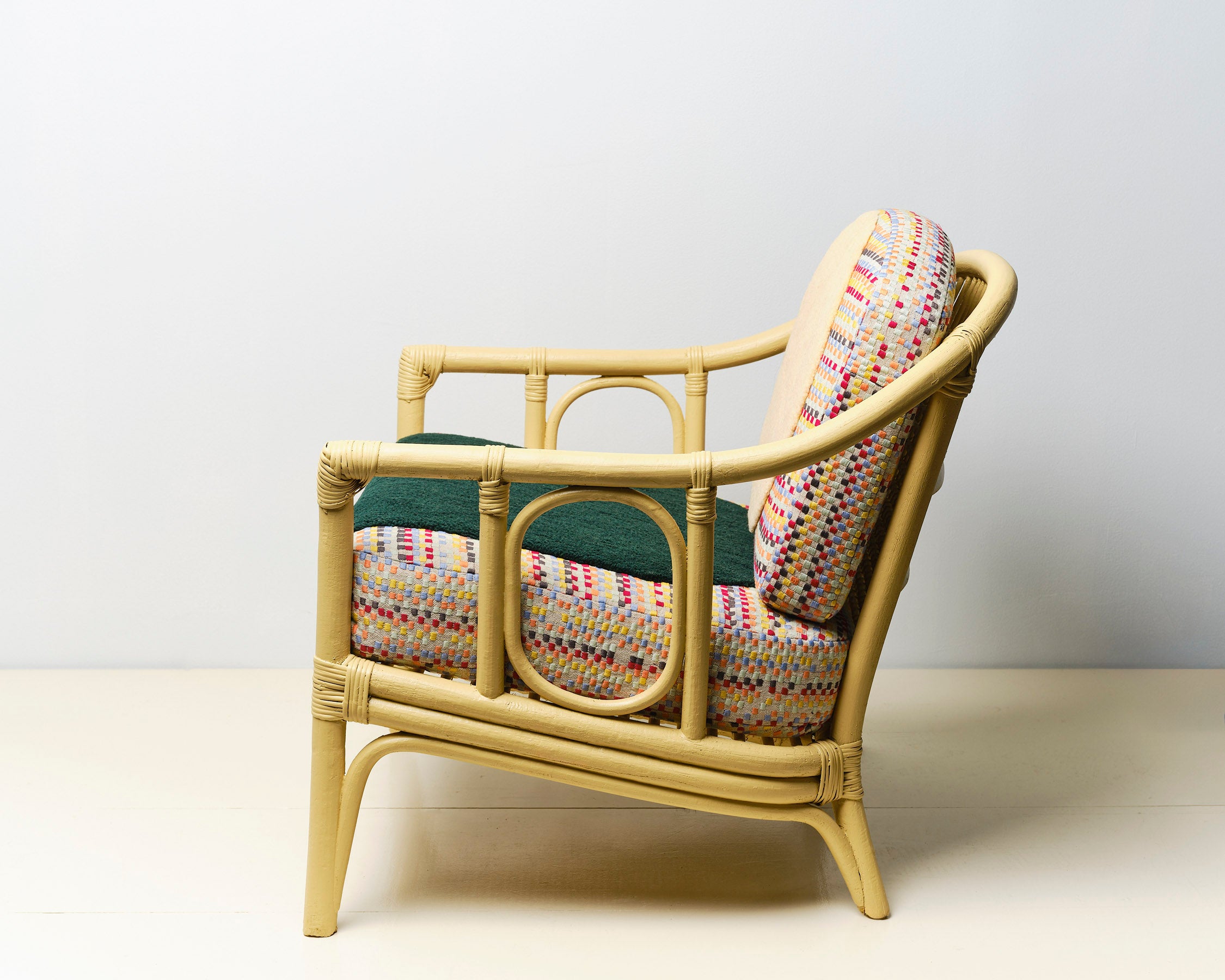Upcycled chair with tufted and embroidered embellishments, side view 