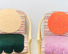 Two upcycled chairs with tufted and embroidered embellishments, close up view 