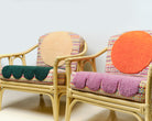 Two upcycled chairs with tufted and embroidered embellishments, side view 