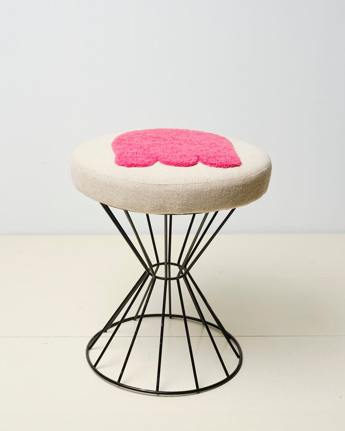 Upcycled stool with tufted embellishments, side view 