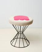 Upcycled stool with tufted embellishments, side view 