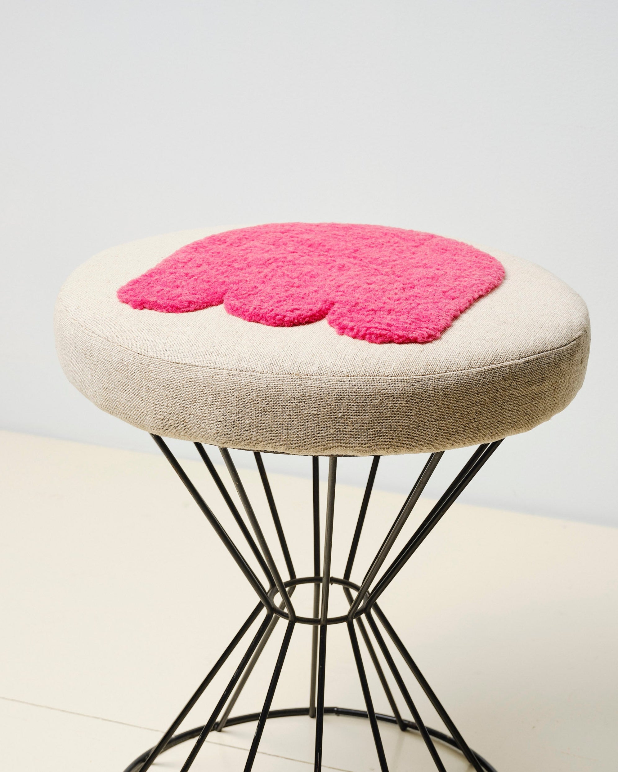 Upcycled stool with tufted embellishments, close up view 