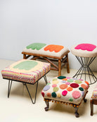 Upcycled footstool with tufted embellishments, group view 