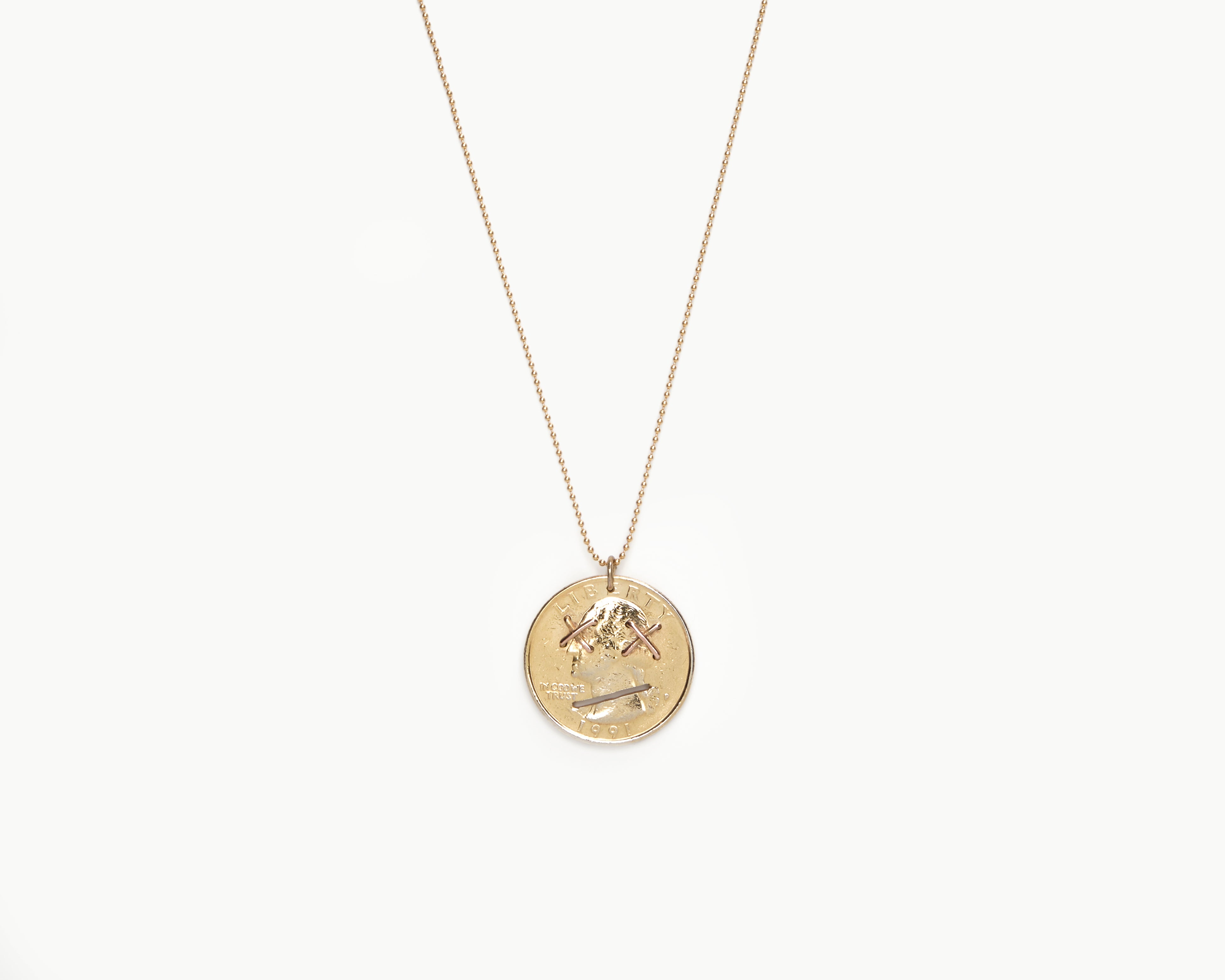 Upcycled necklace with gold plated quarter, close up view  