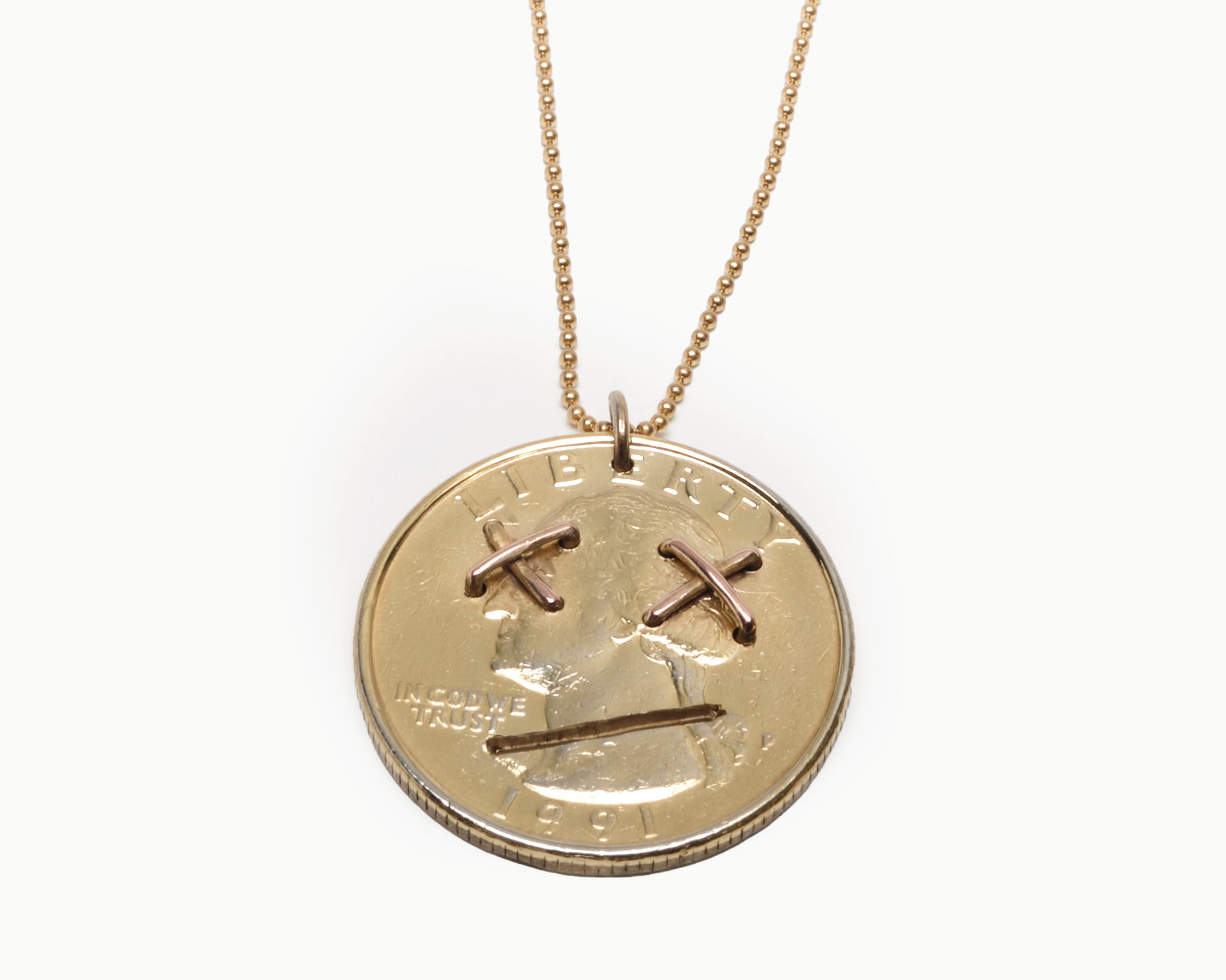 Upcycled necklace with gold plated quarter, close up view  