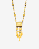 Vintage yellow beaded necklace, closeup view.