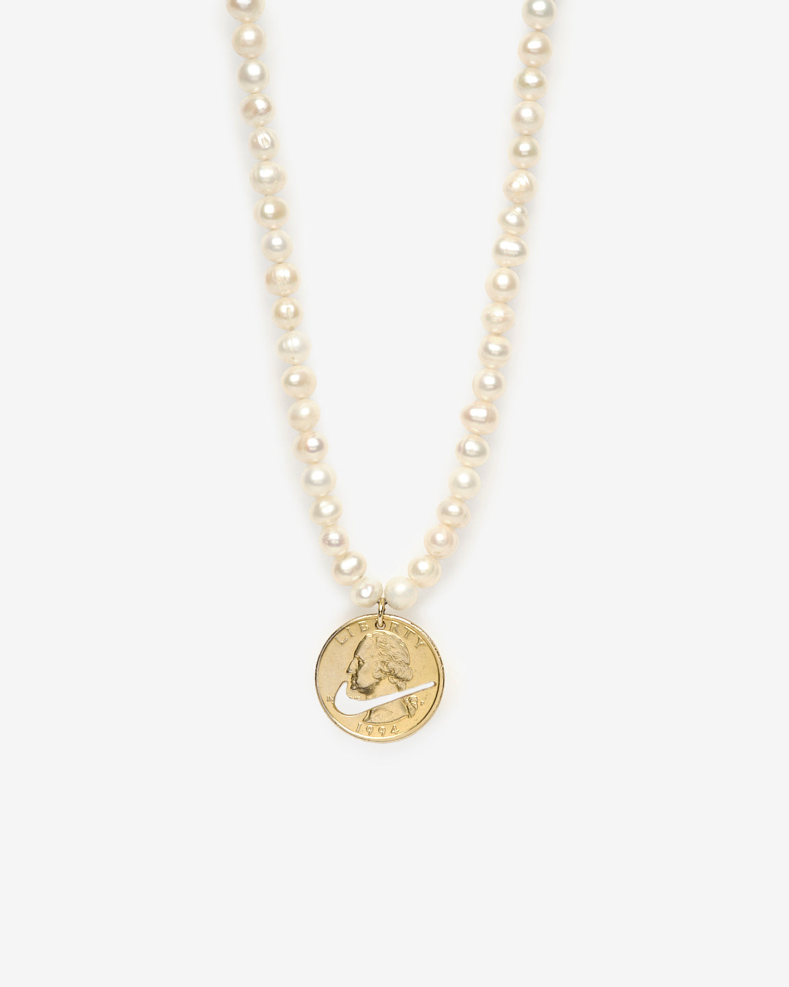 Upcycled necklace with gold plated quarter with pearl strand, close up view  