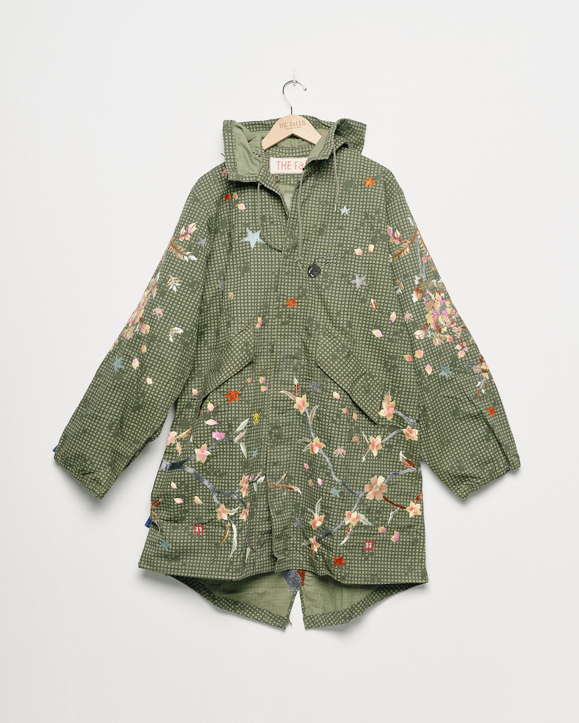 Upcycled parka with floral embroidery, front view. 
