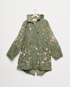 Upcycled parka with floral embroidery, front view. 