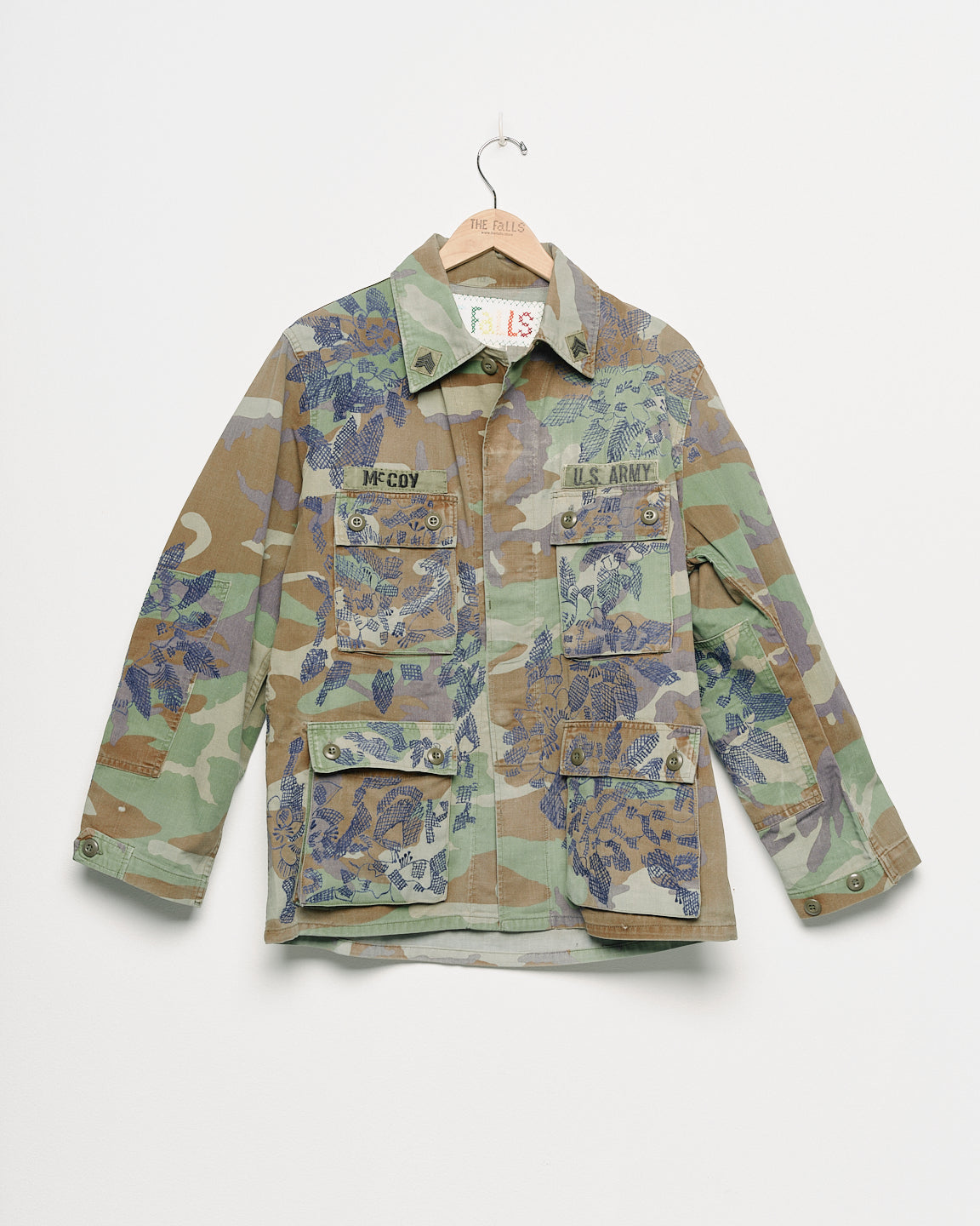 Vintage camouflage fatigue jacket with embroidered, front view. 