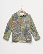 Vintage camouflage fatigue jacket with embroidered, front view. 