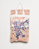 Repurposed vintage feedback tote with embroidered florals, front view. 